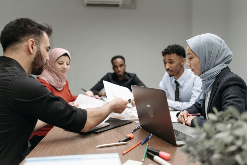 Colleagues working together at table managing unconscious bias.